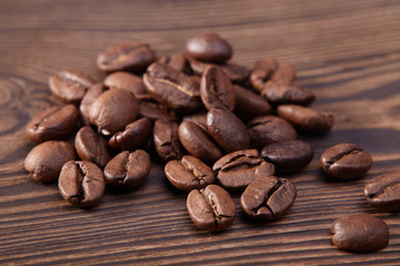 Coffee beans on wooden background