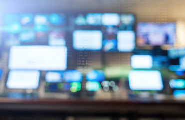 Broadcast studio. Professional sound engineer's console.  Remote control for the sound engineer. Mixing consoles. blurred background, monitors