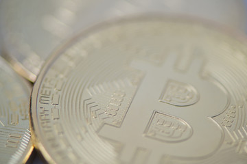 several gold bitcoin closeup, blurred photo. electronic money