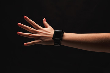 Hand gestures - woman showing open palm, isolated at black