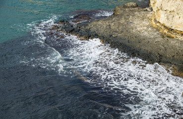 Deep dark blue sea waves breaking on a rocks, Cape Tarkhankut