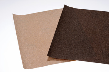 Two sandpaper sheets in bright and dark, contrast background