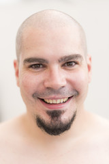 Bald man portrait with goatee