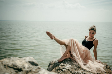 athletic woman engaged in stretching, warm summer day, exercise in the open air