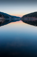 Winter lake landscape at sunset with beautiful reflection, national park harz