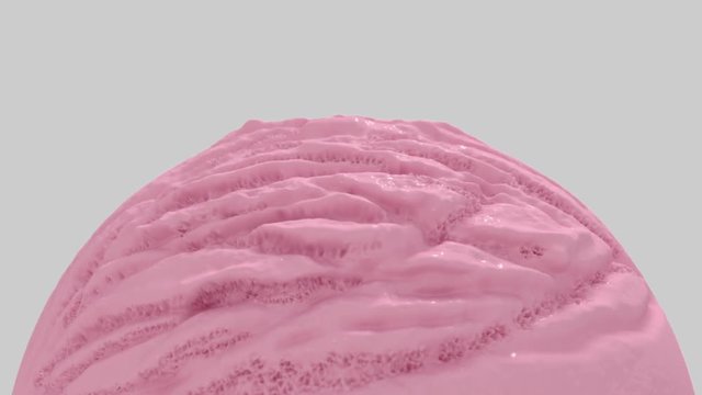 A closeup of a rotating creamy scoop ball of strawberry ice-cream on an isolated background