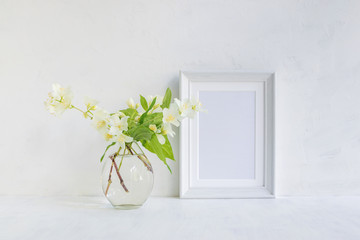 Mockup with a white frame and white jasmine flowers
