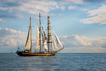 Fototapeta na wymiar Tall ship race in the Black sea. Large white sails on masts. Beauty seascape.