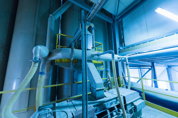 Factory workshop interior and machines on glass production background