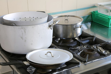 pots in the industrial kitchen during meal preparation