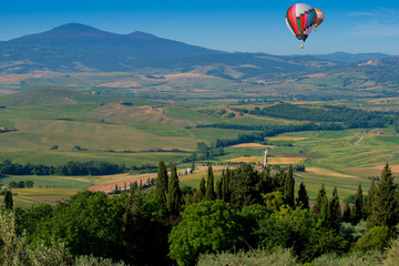 Colorful hot air balloons flying over the mountain