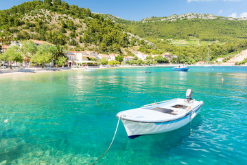 Naklejka na ściany i meble amazing crystal clear sea with boat and beach in Peljesac peninsula, Dalmatia, Croatia