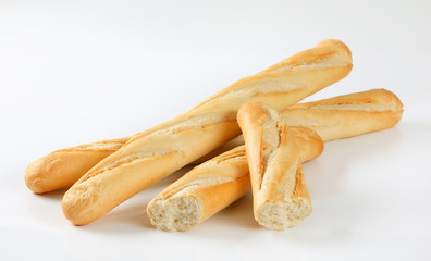 whole and halved French baguettes