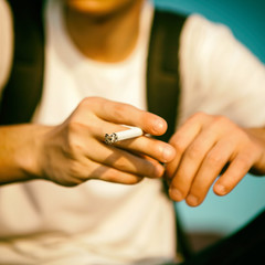 Fototapeta na wymiar Person with a Cigarette