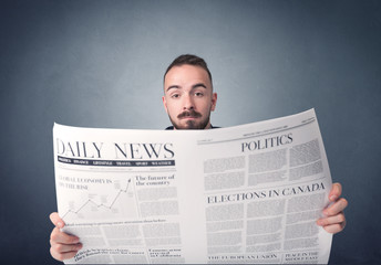 Businessman reading newspaper