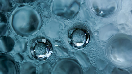 Abstract water bubbles on blue background