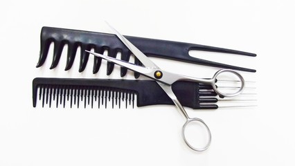 Hairdressing tools on white background.