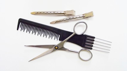 Hairdressing tools on white background.