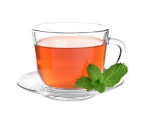 Glass cup of hot tea with mint on white background