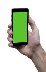 Male hand holding black cellphone with green screen at isolated white background.