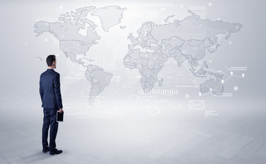 Fototapeta premium Man looking at map with objects in his hand