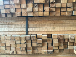 row stack of wood in storage warehouse