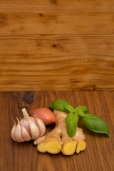 wooden board old and ginger basil garlic