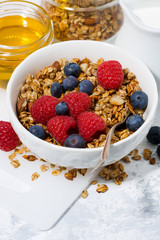 fresh cottage cheese with granola and honey, vertical closeup