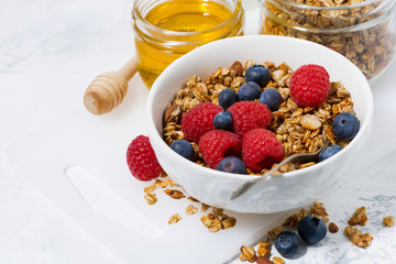 fresh cottage cheese with granola and honey, closeup