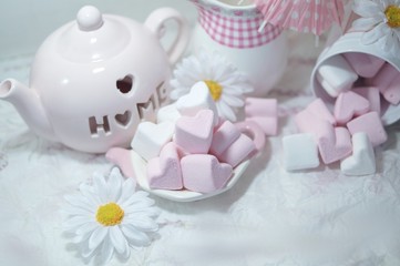 Pink and White Marshmallow  marshmallow in heart shape on the  table . Pastel color dessert. Selective focus. Soft focus
