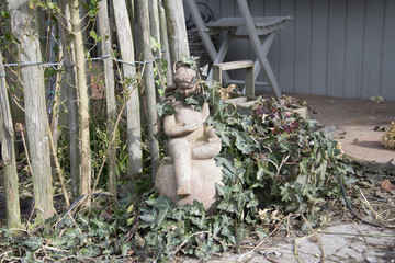 Statue in the garden with Ivy