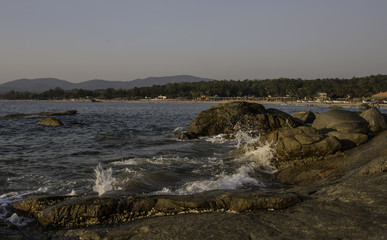 View of beach side with rocks.