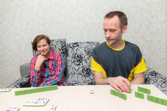 Man And Woman Playing Mahjong