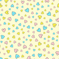 Cartoon seamless pattern with scattered colorful hearts. Endless print. Drawn by hand.