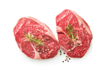 Poster fresh raw rib eye steaks isolated on white background © Alexander Raths