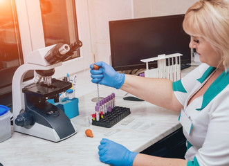 Laboratory assistant conducts a blood test.