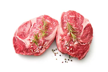 Foto op Plexiglas anti-reflex fresh raw rib eye steaks isolated on white background © Alexander Raths