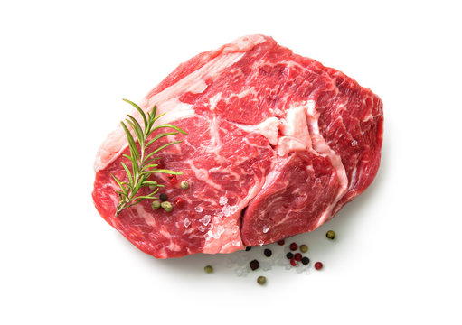 fresh raw rib eye steak isolated on white background