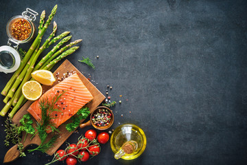 Fresh salmon fillet with aromatic herbs, spices and vegetables