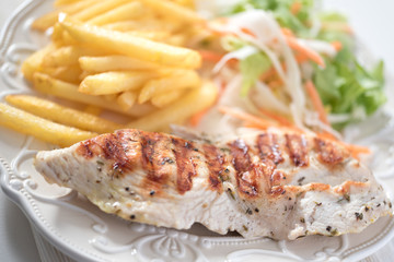 Tasteful roasted turkey steak with chips and vegetable