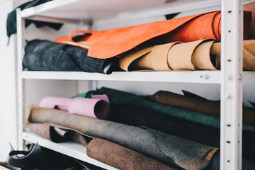 Pile Cow Leather craft roll up overlapse on shelf background for make wallet, shoe, bag, shirt