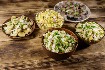 Various festive dishes on wooden table