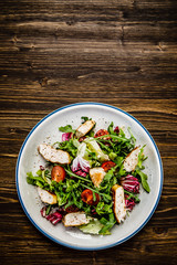 Caesar salad on wooden table 