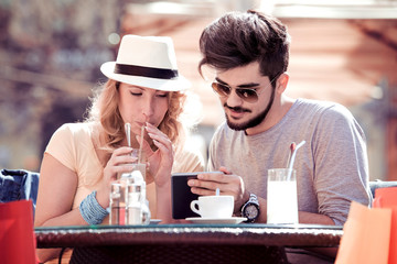 Happy young couple in cafe, having a great time together