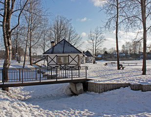 small houses for rest on winter lake in off-season