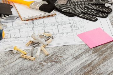 Different construction tools, wooden background