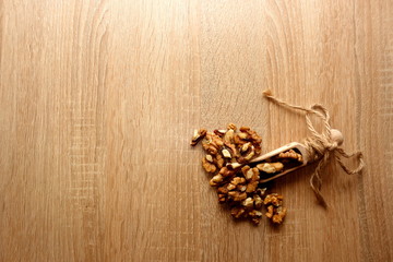 Walnuts on rustic wooden background, copy space for your text or object