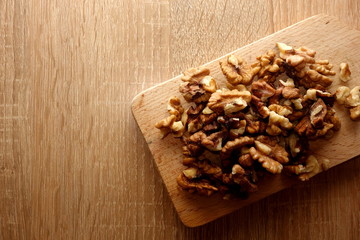 Healthy walnuts on wooden background, copy space for your design