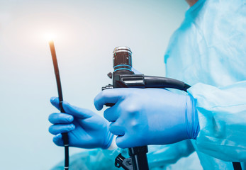 Endoscopy at the hospital. Doctor holding endoscope before gastroscopy - obrazy, fototapety, plakaty