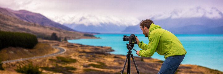 Travel photographer man taking nature video of mountain landscape at Peter's lookout, New Zealand...